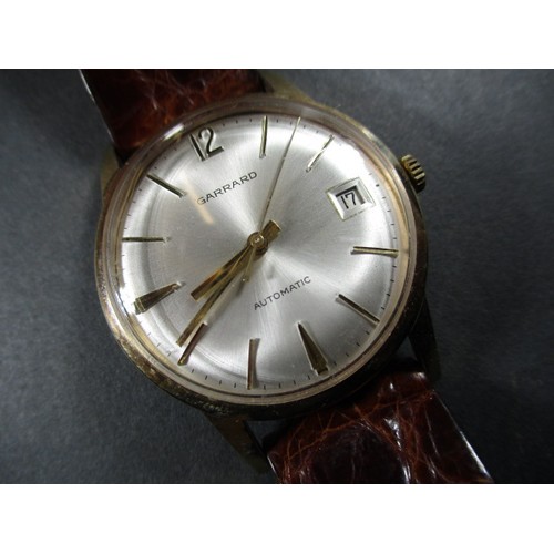 85 - A vintage 9ct gold cased gents automatic wristwatch from Garrards of London, in working order with o... 