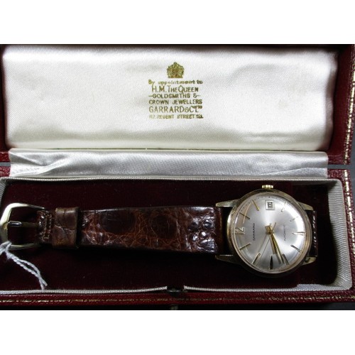 85 - A vintage 9ct gold cased gents automatic wristwatch from Garrards of London, in working order with o... 