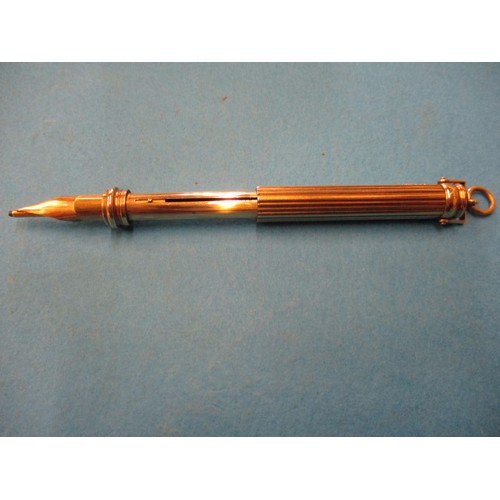 63 - An early 20th century 9ct gold propelling pen and pencil, approx. open length 12cm approx. weight 19... 