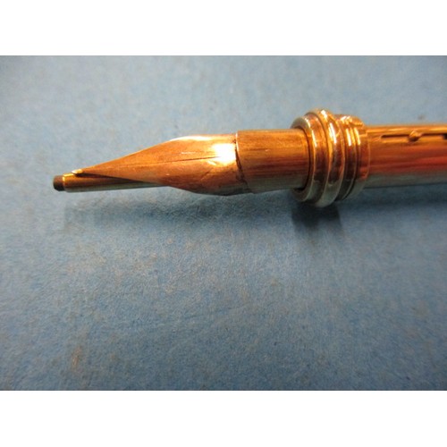 63 - An early 20th century 9ct gold propelling pen and pencil, approx. open length 12cm approx. weight 19... 