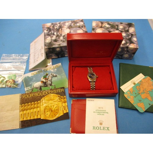 86 - A ladies Rolex Oyster perpetual datejust watch with original box and paperwork, in working order, Ca... 