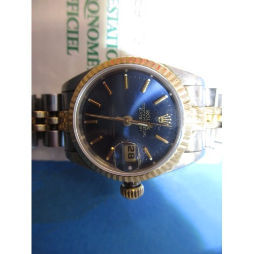 86 - A ladies Rolex Oyster perpetual datejust watch with original box and paperwork, in working order, Ca... 