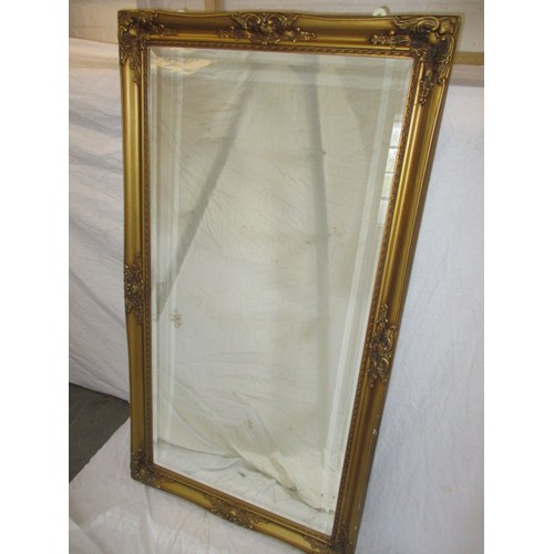 333 - A large gilt framed wall mirror, approx. size, H 134c m W 73cm in good condition with general age re... 