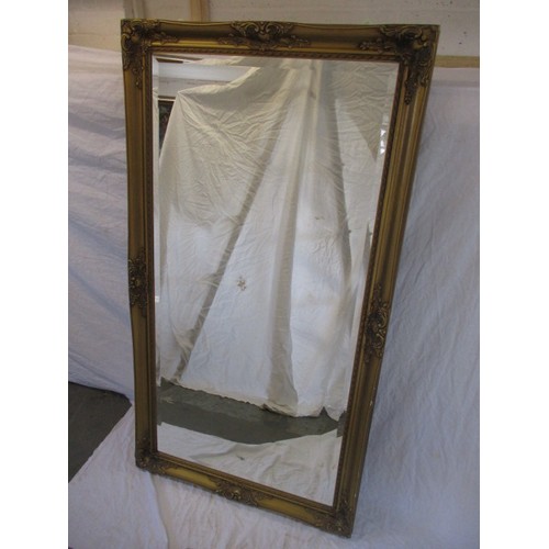 333 - A large gilt framed wall mirror, approx. size, H 134c m W 73cm in good condition with general age re... 