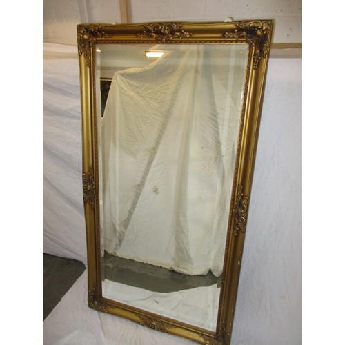 333 - A large gilt framed wall mirror, approx. size, H 134c m W 73cm in good condition with general age re... 