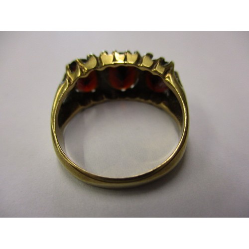 13 - A vintage 9ct yellow gold ring, set with 3 garnets, approx. ring size ‘L’ approx. weight 3.4g, in go... 