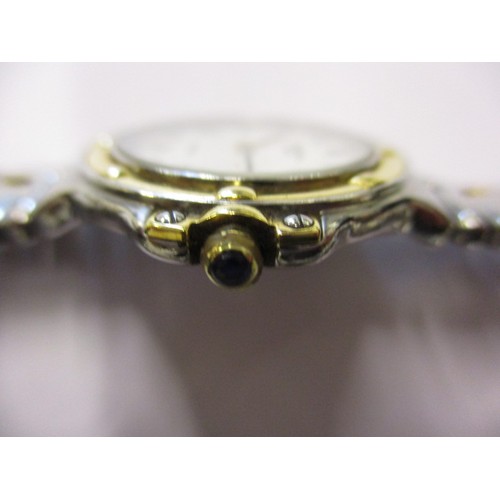 88 - A ladies Raymond Weil watch with yellow metal bezel and date window, in pre-owned condition and curr... 