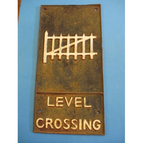 345 - A vintage cast iron railway level crossing sign, approx. size 58x29cm, having age-related marks and ... 