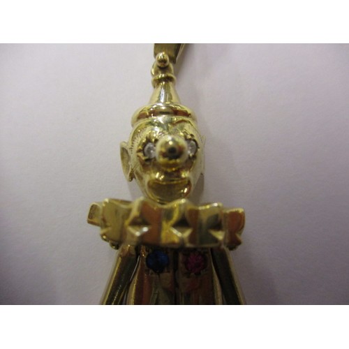 57 - A large 9ct yellow gold Clown pendant, set with various stones and having moving limbs, approx. weig... 