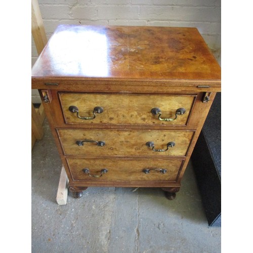 323 - A 20th century maple chest of 3 drawers with fold over table top resting on loapers, approx. dimensi... 