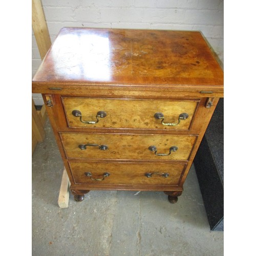 323 - A 20th century maple chest of 3 drawers with fold over table top resting on loapers, approx. dimensi... 