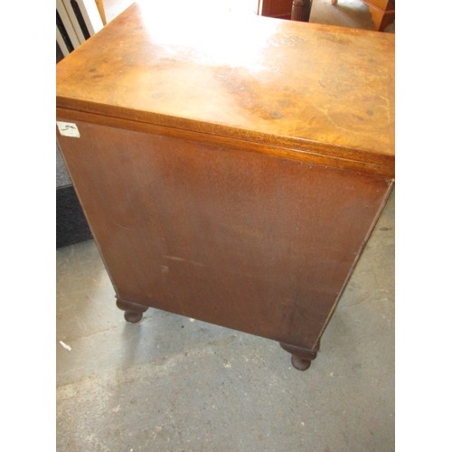 323 - A 20th century maple chest of 3 drawers with fold over table top resting on loapers, approx. dimensi... 