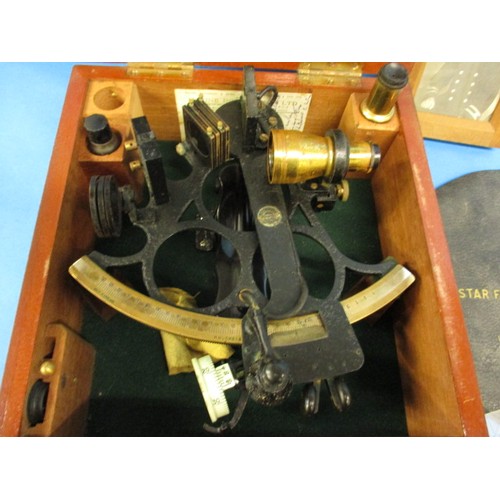 218 - A 1943 marine sextant by Henry Hughes & Son Ltd, in original fitted box, comes with several United S... 