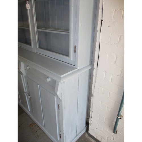 275 - An early 20th century painted pine kitchen dresser with glazed door top, having 2 cupboard base, in ... 