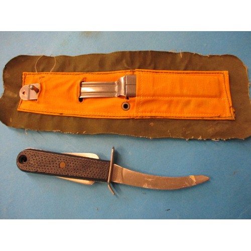 212 - A vintage air crew survival knife and an American pilot’s knee mounted clipboard, both in pre-owned ... 