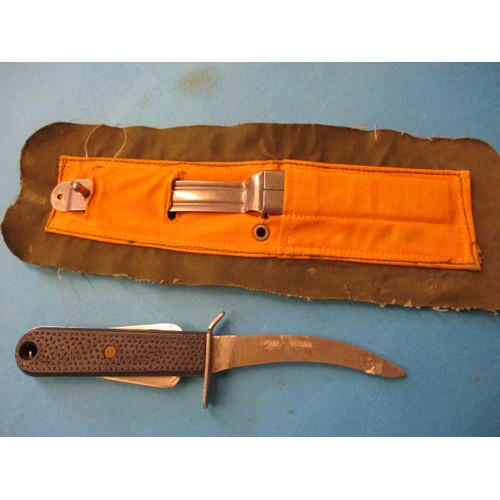 212 - A vintage air crew survival knife and an American pilot’s knee mounted clipboard, both in pre-owned ... 