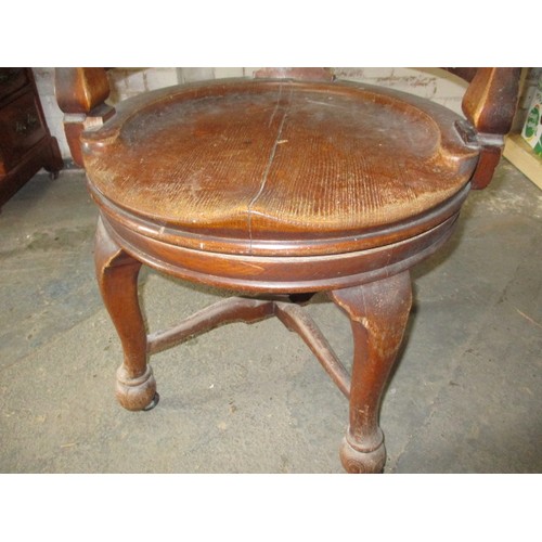 274 - An antique Captains/office swivel chair with later castors, approx. height 86cm, having had some age... 