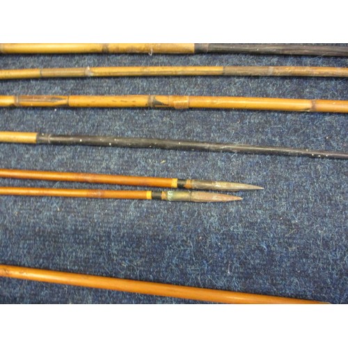 234 - A vintage English longbow and a North African metal and bone example and a collection of arrows, all... 