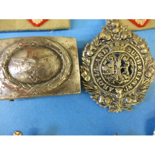 210 - A parcel of vintage military metal and cloth badges, all in used condition with general age-related ... 