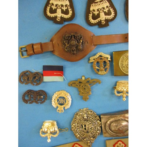 210 - A parcel of vintage military metal and cloth badges, all in used condition with general age-related ... 