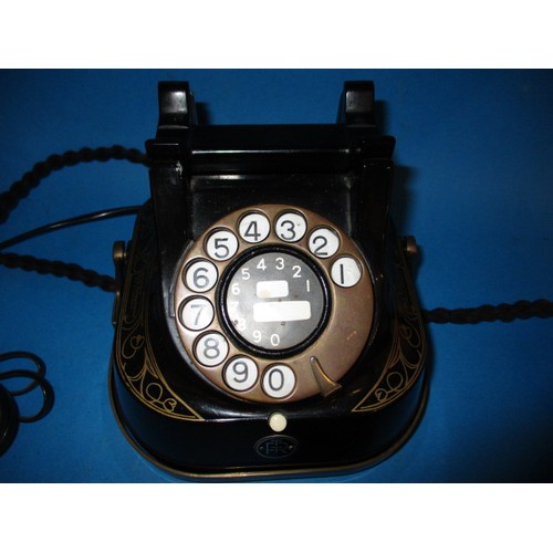 366 - A vintage black enamel dial type telephone, converted to work on modern system, marked Bell Telephon... 