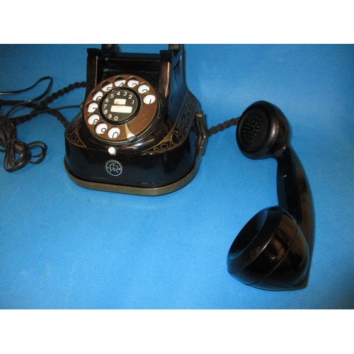 366 - A vintage black enamel dial type telephone, converted to work on modern system, marked Bell Telephon... 