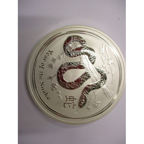 113 - An Australian 10oz .999 fine silver 10 Dollar coin, depicting the Chinese year of the snake, in unci... 