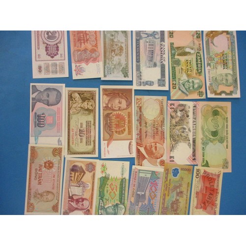 194 - A quantity of uncirculated world bank notes, of various denominations