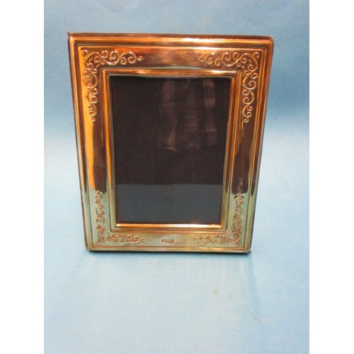 134 - A sterling silver photo frame, approx. dimensions 18x14cm and a small parcel of other silver trinket... 