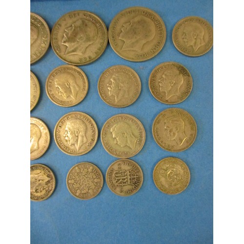 131 - A quantity of pre-decimal part silver coins to include a boxed World War II numismatic set with pape... 