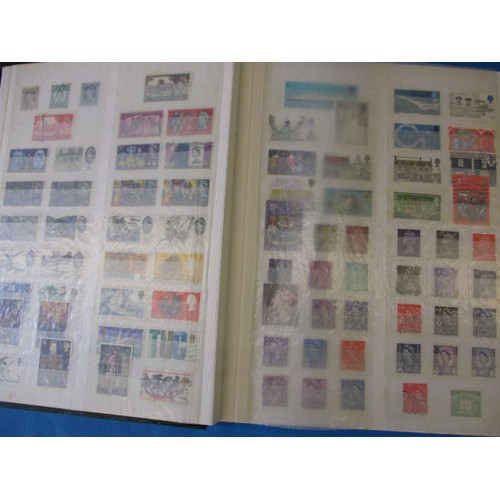 334 - An album of pre-decimal and later British stamps, most with posted cancellation marks