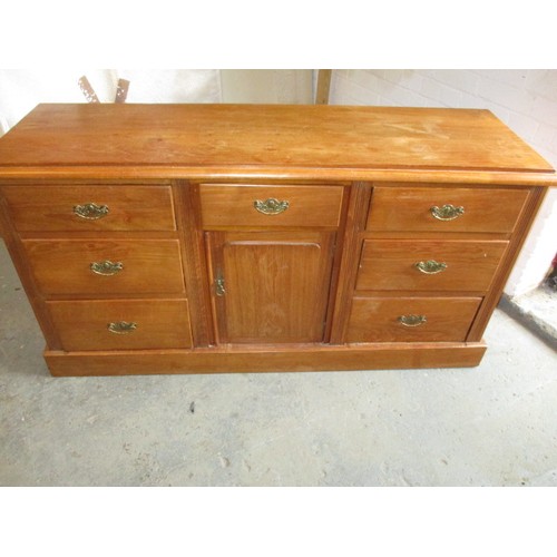 277 - An early 20th century oak sideboard, having 7 graduated drawers and cupboard, with some age-related ... 