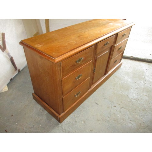 277 - An early 20th century oak sideboard, having 7 graduated drawers and cupboard, with some age-related ... 