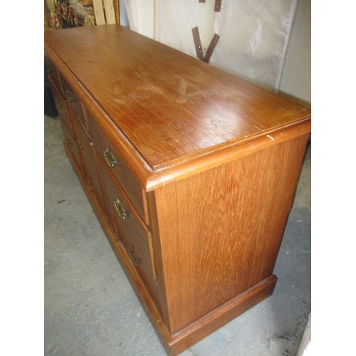 277 - An early 20th century oak sideboard, having 7 graduated drawers and cupboard, with some age-related ... 