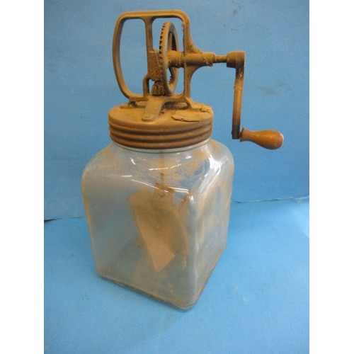 248 - A vintage ‘Blow’ butter churn with wood paddles and glass base jar, having age-related marks and rep... 