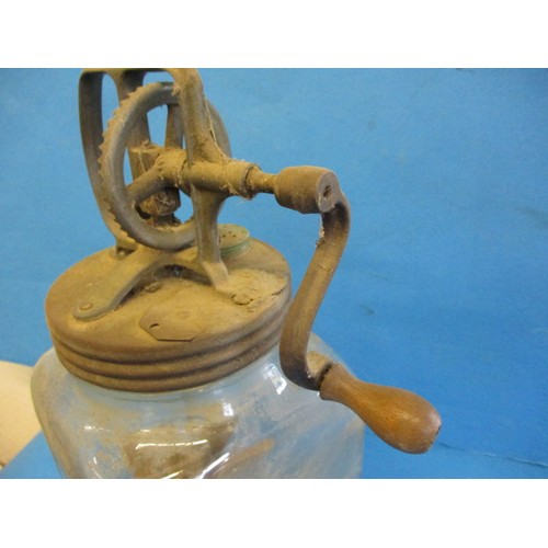 248 - A vintage ‘Blow’ butter churn with wood paddles and glass base jar, having age-related marks and rep... 