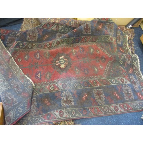 363 - 4 vintage Persian hand woven wool rugs, all in well used condition with some fraying and stains, and... 