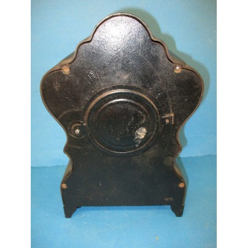 291 - A vintage Black painted metal mantle clock, having loose front foot and not tested to check function... 