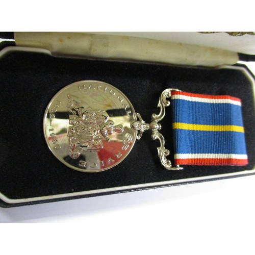 213 - A National service medal, in original box and in un-used condition with card, number 16440