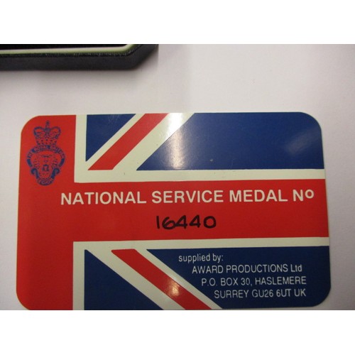 213 - A National service medal, in original box and in un-used condition with card, number 16440