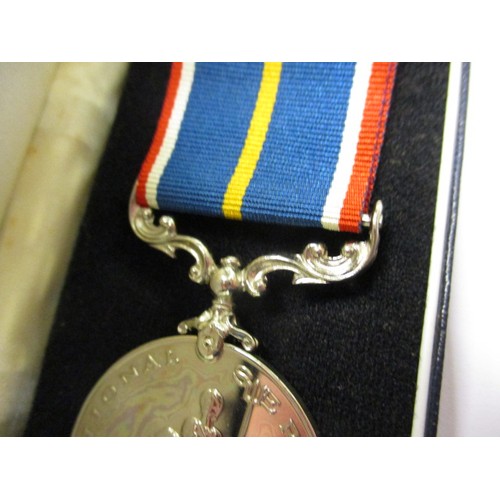 213 - A National service medal, in original box and in un-used condition with card, number 16440