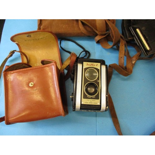 354 - A quantity of vintage cameras and binoculars, various models, all in pre-owned condition with genera... 