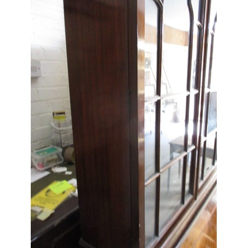 298 - An antique bureau bookcase, having various compartments and glazed top cabinet. Comes in two part fo... 