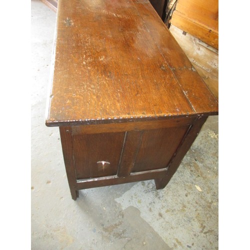 281 - An 18th century oak coffer, of panel construction on style legs and having carved decoration approx.... 