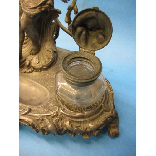 168 - An early 20th century pewter desk top ink stand, having general age related marks and a small split ... 