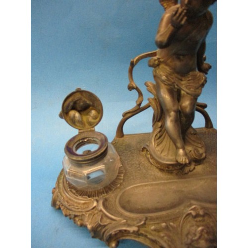 168 - An early 20th century pewter desk top ink stand, having general age related marks and a small split ... 