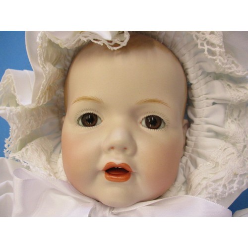 351 - A German porcelain doll, having no observed damage, approx. length 44cm