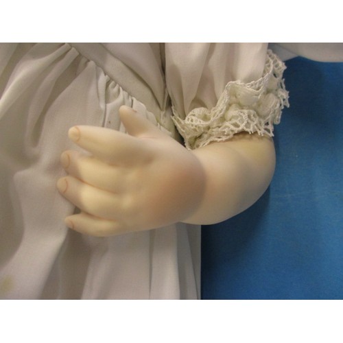 351 - A German porcelain doll, having no observed damage, approx. length 44cm