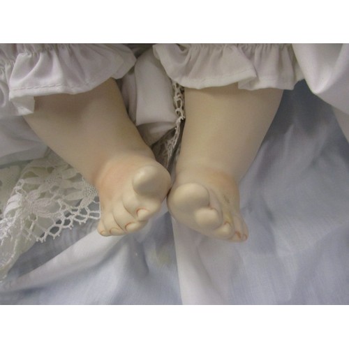 351 - A German porcelain doll, having no observed damage, approx. length 44cm