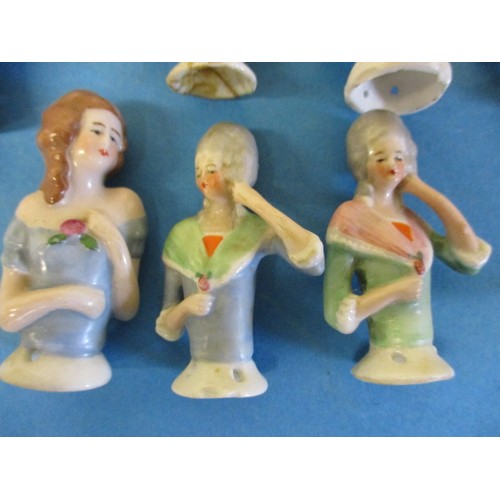 183 - A collection of antique and later porcelain half dolls, one having been broken at base and re-stuck ... 